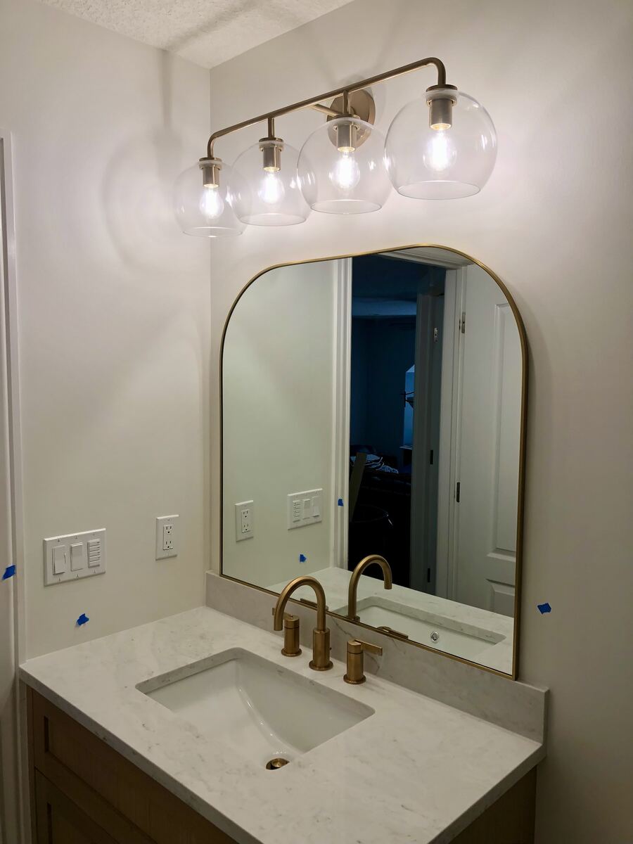 Tub and shower combo lighting installation with tile surround