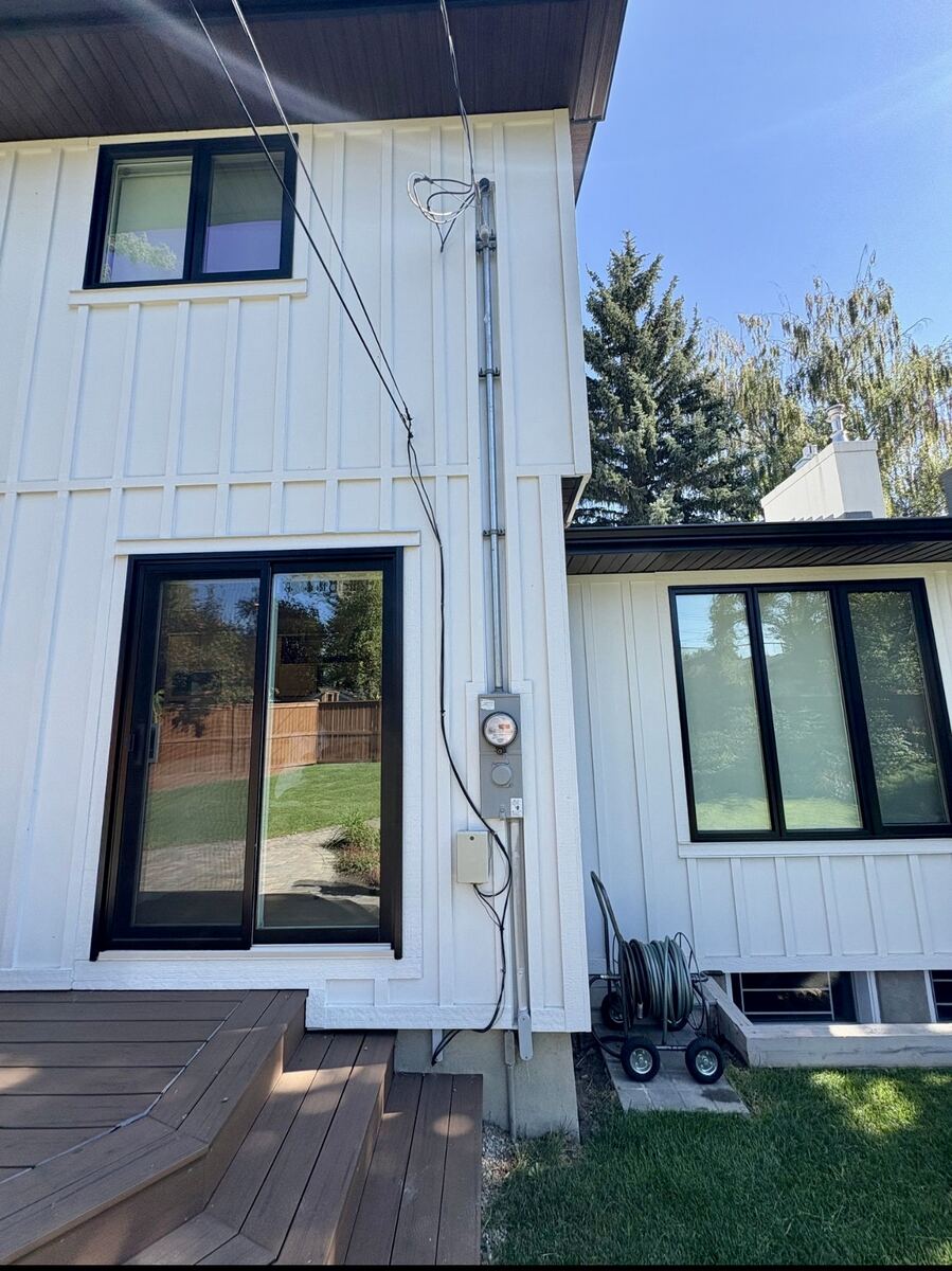 Exterior electrical service entrance and meter on a Calgary home